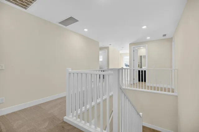 a living room with furniture a fireplace and a table