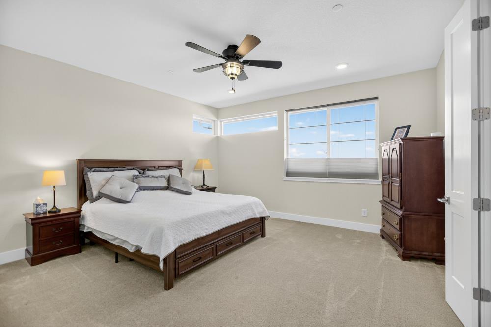 12086 Mircado Way Rancho Cordova, CA 95742 - Photo 47 of 84 a bedroom with a bed and a ceiling fan