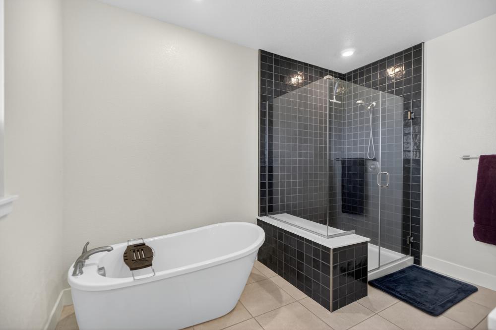 12086 Mircado Way Rancho Cordova, CA 95742 - Photo 52 of 84 a bathroom with a bathtub and shower