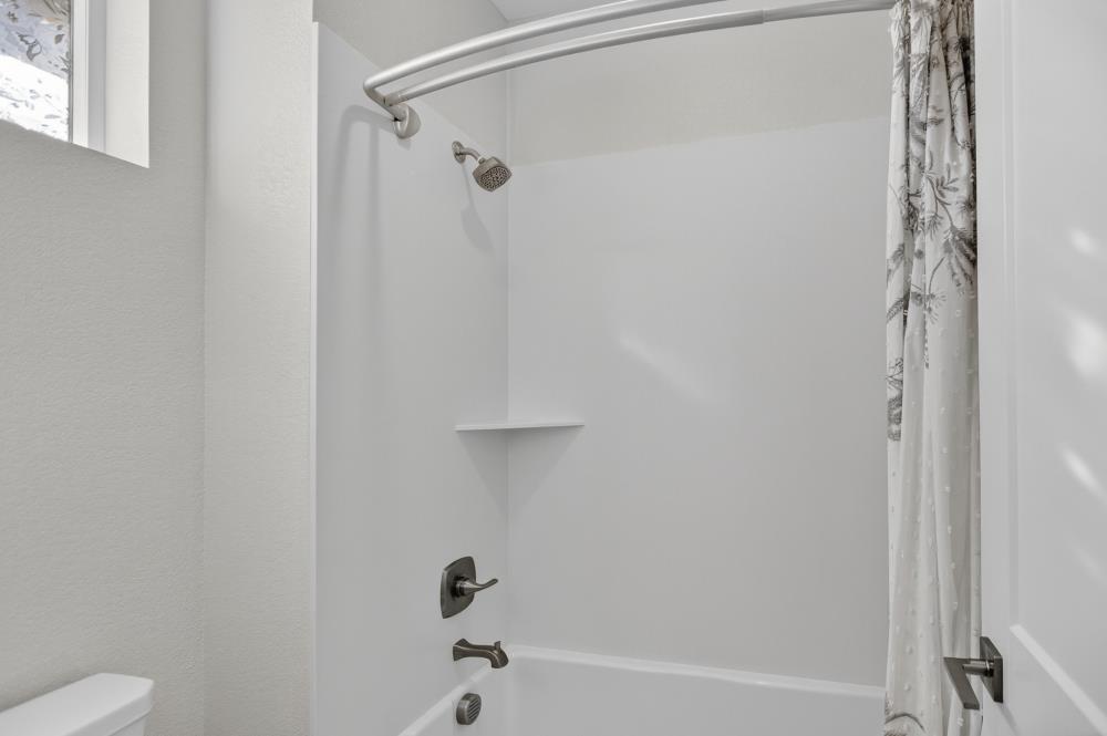 12086 Mircado Way Rancho Cordova, CA 95742 - Photo 62 of 84 a bathroom with a shower and a toilet