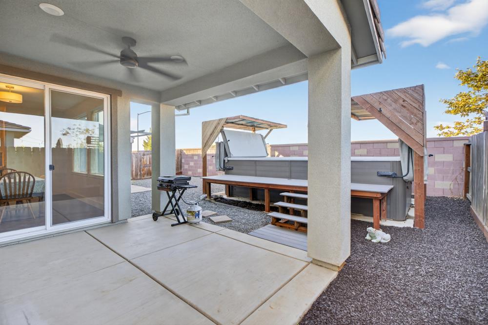 12086 Mircado Way Rancho Cordova, CA 95742 - Photo 69 of 84 a living room with furniture a fireplace and a table