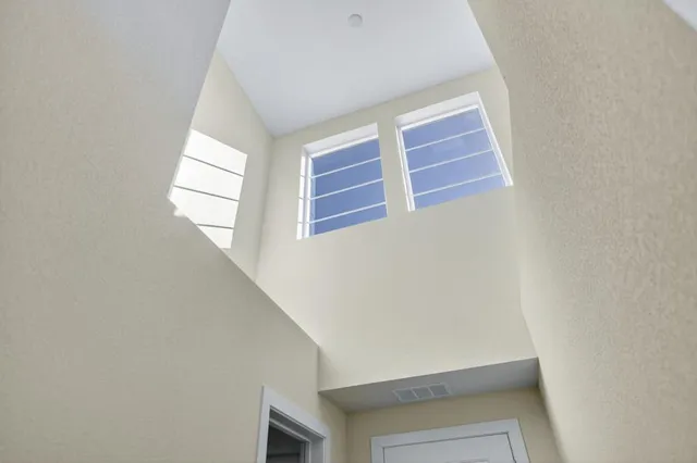 a large kitchen with stainless steel appliances granite countertop a stove a sink a dining table and chairs