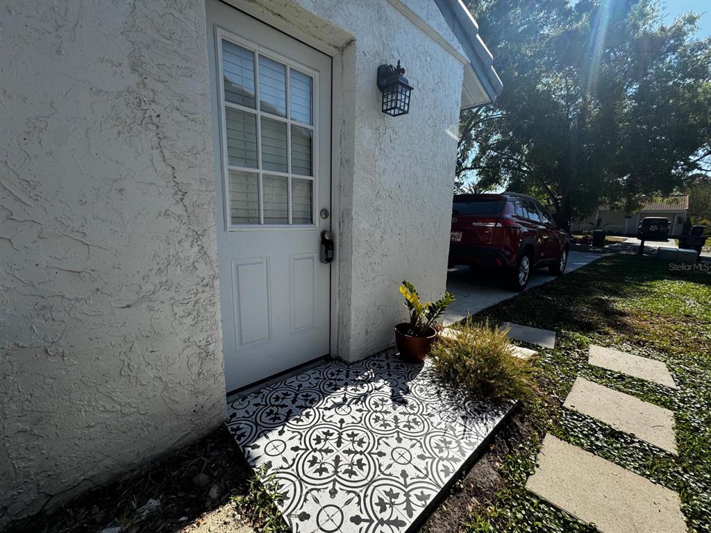 10132 Bluff Court Orlando, FL 32821 - Photo 1 of 1 a wooden bench sitting in front of a building