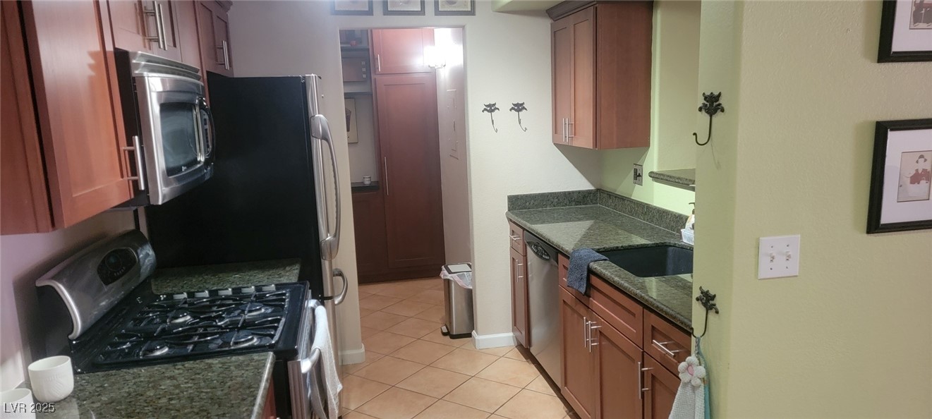 7885 West Flamingo Road, Unit 1010 Las Vegas, NV 89147 - Photo 11 of 32 Kitchen featuring appliances with stainless steel