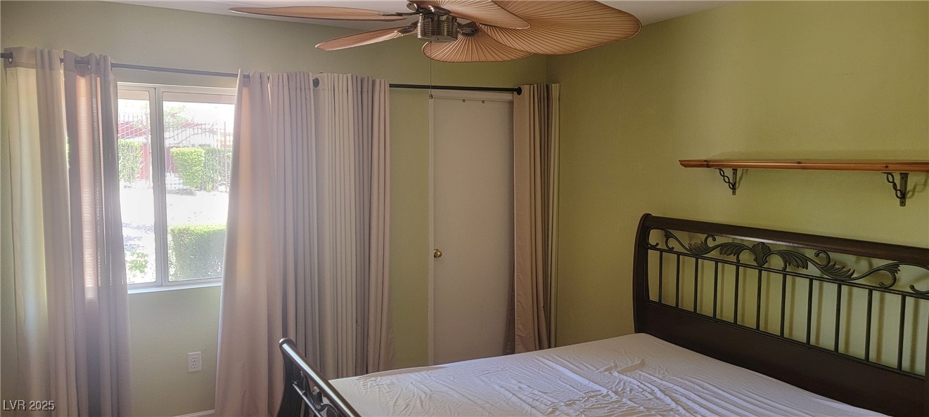 7885 West Flamingo Road, Unit 1010 Las Vegas, NV 89147 - Photo 18 of 32 Bedroom with multiple windows and ceiling fan