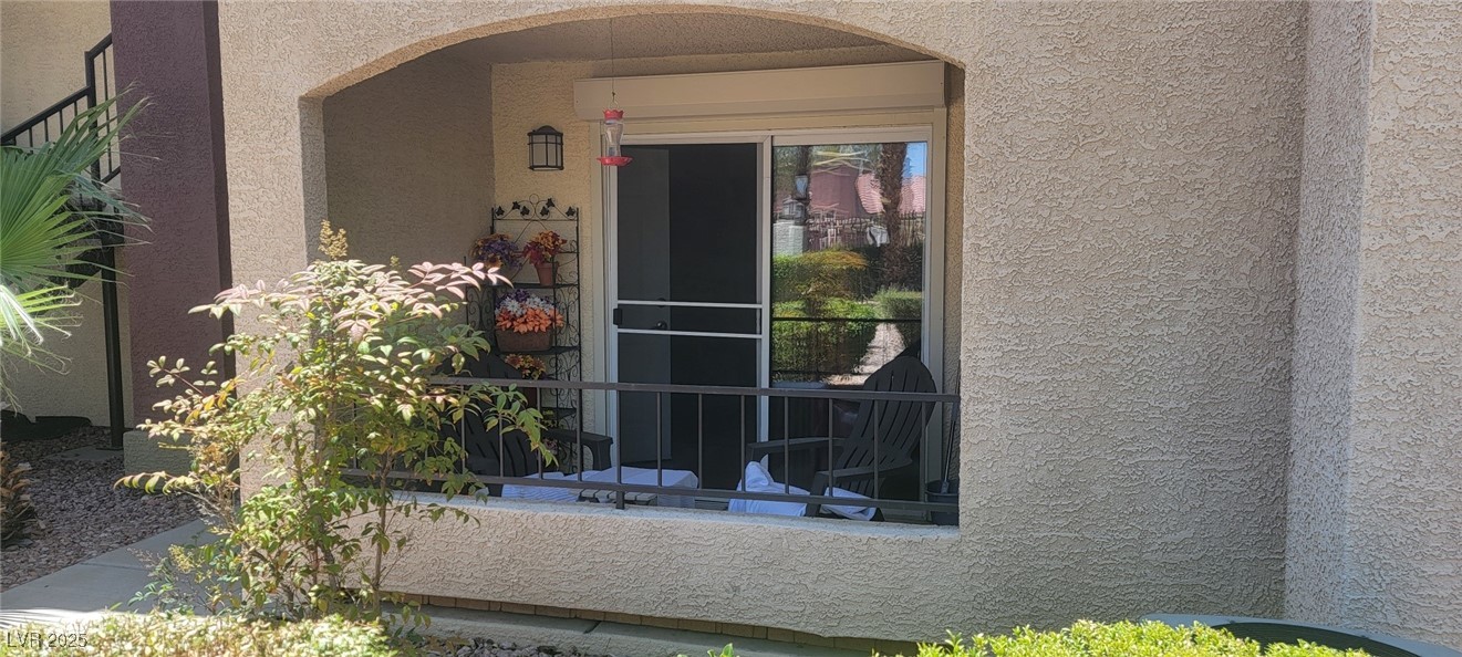 7885 West Flamingo Road, Unit 1010 Las Vegas, NV 89147 - Photo 2 of 32 Property entrance with stucco siding