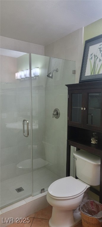 7885 West Flamingo Road, Unit 1010 Las Vegas, NV 89147 - Photo 23 of 32 Full bathroom featuring a stall shower and tile pa