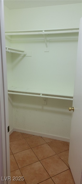 7885 West Flamingo Road, Unit 1010 Las Vegas, NV 89147 - Photo 24 of 32 Spacious closet with light tile patterned flooring