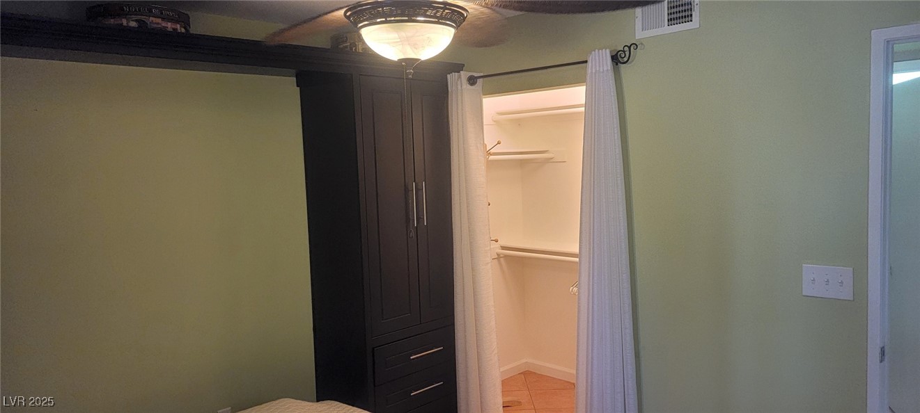 7885 West Flamingo Road, Unit 1010 Las Vegas, NV 89147 - Photo 28 of 32 Unfurnished bedroom featuring tile patterned floor