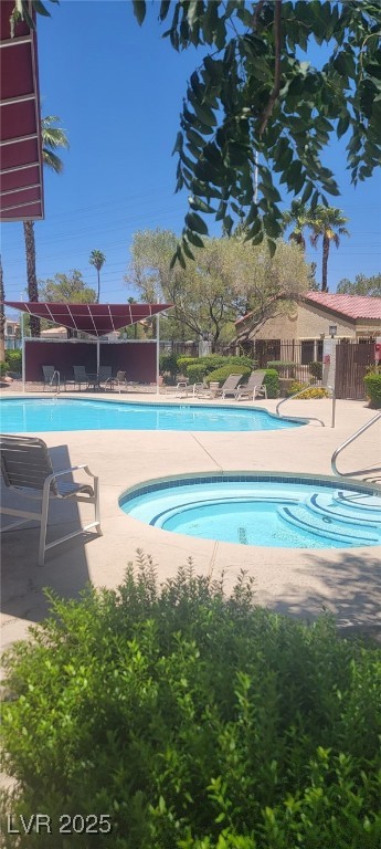 7885 West Flamingo Road, Unit 1010 Las Vegas, NV 89147 - Photo 32 of 32 Community pool with a patio area