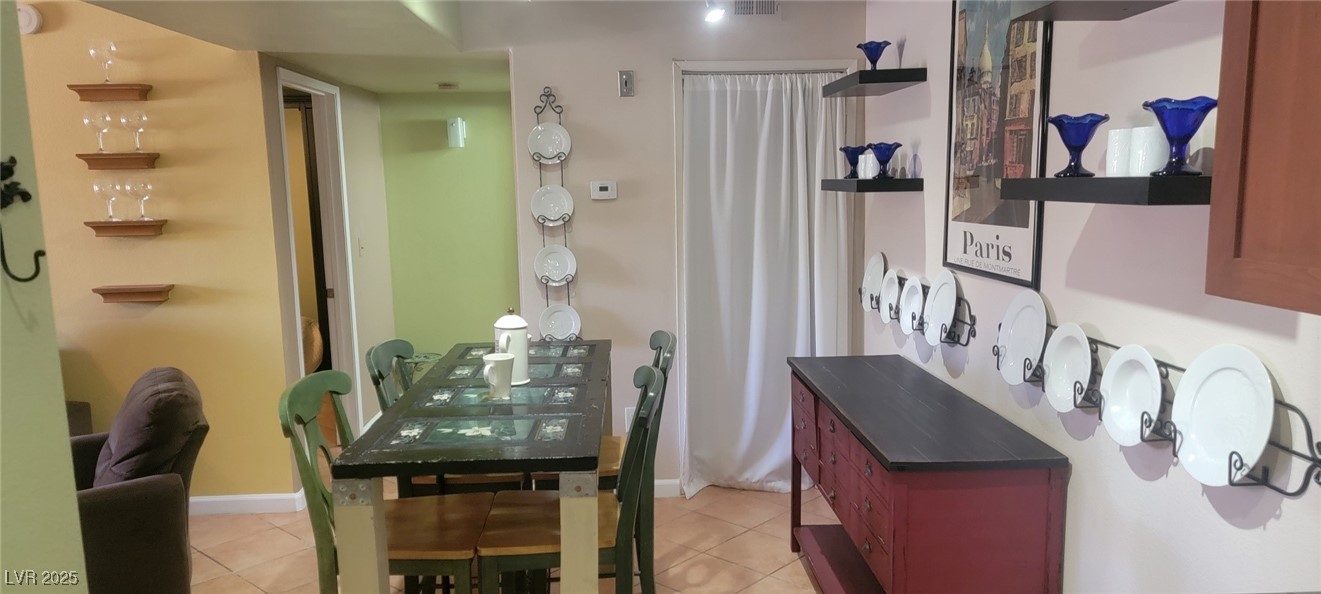7885 West Flamingo Road, Unit 1010 Las Vegas, NV 89147 - Photo 10 of 32 Dining area with light tile patterned flooring