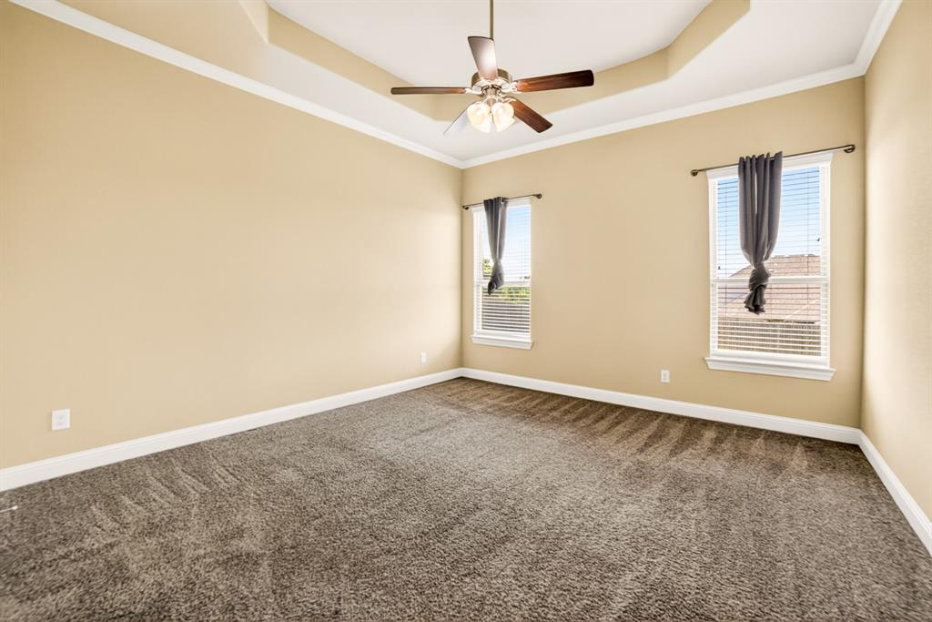552 Winnetka Drive Oak Point, TX 75068 - Photo 24 of 40 an empty room with windows and fan