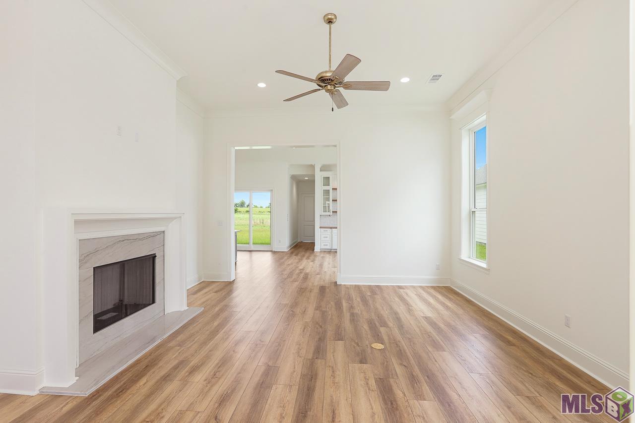 4451 Camargue Avenue Baton Rouge, LA 70820 - Photo 9 of 26 Den with Gas Fireplace