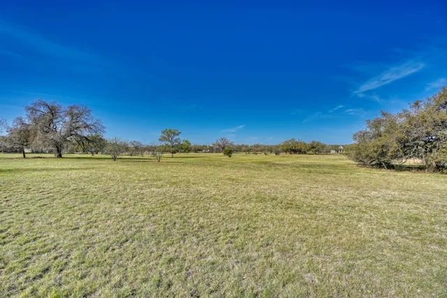 a view of a swimming pool with an outdoor space and seating area