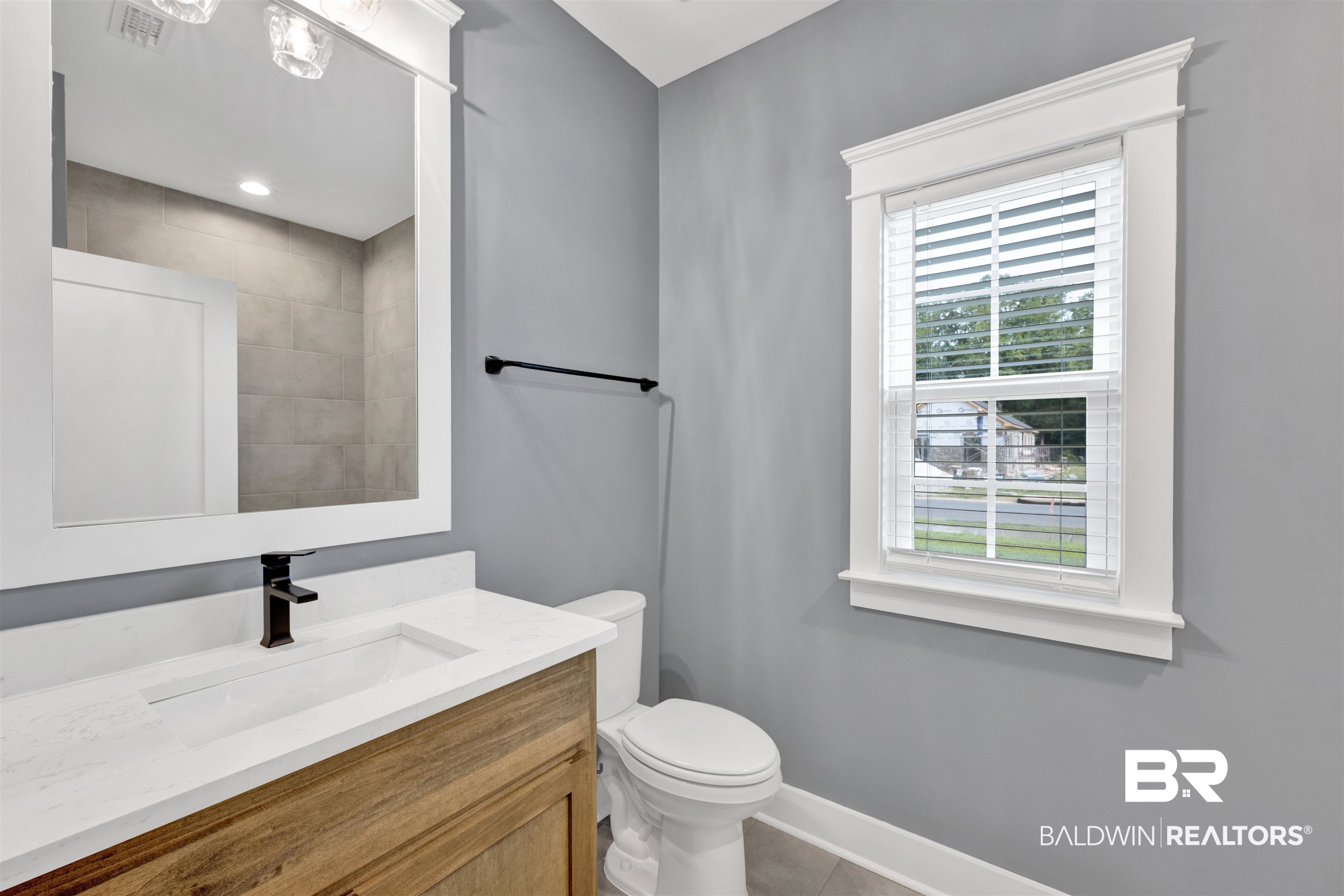 27371 Patch Pl Loop Daphne, AL 36526 - Photo 58 of 63 Bathroom vanity with a white countertop, undermount sink, and dark bronze faucet