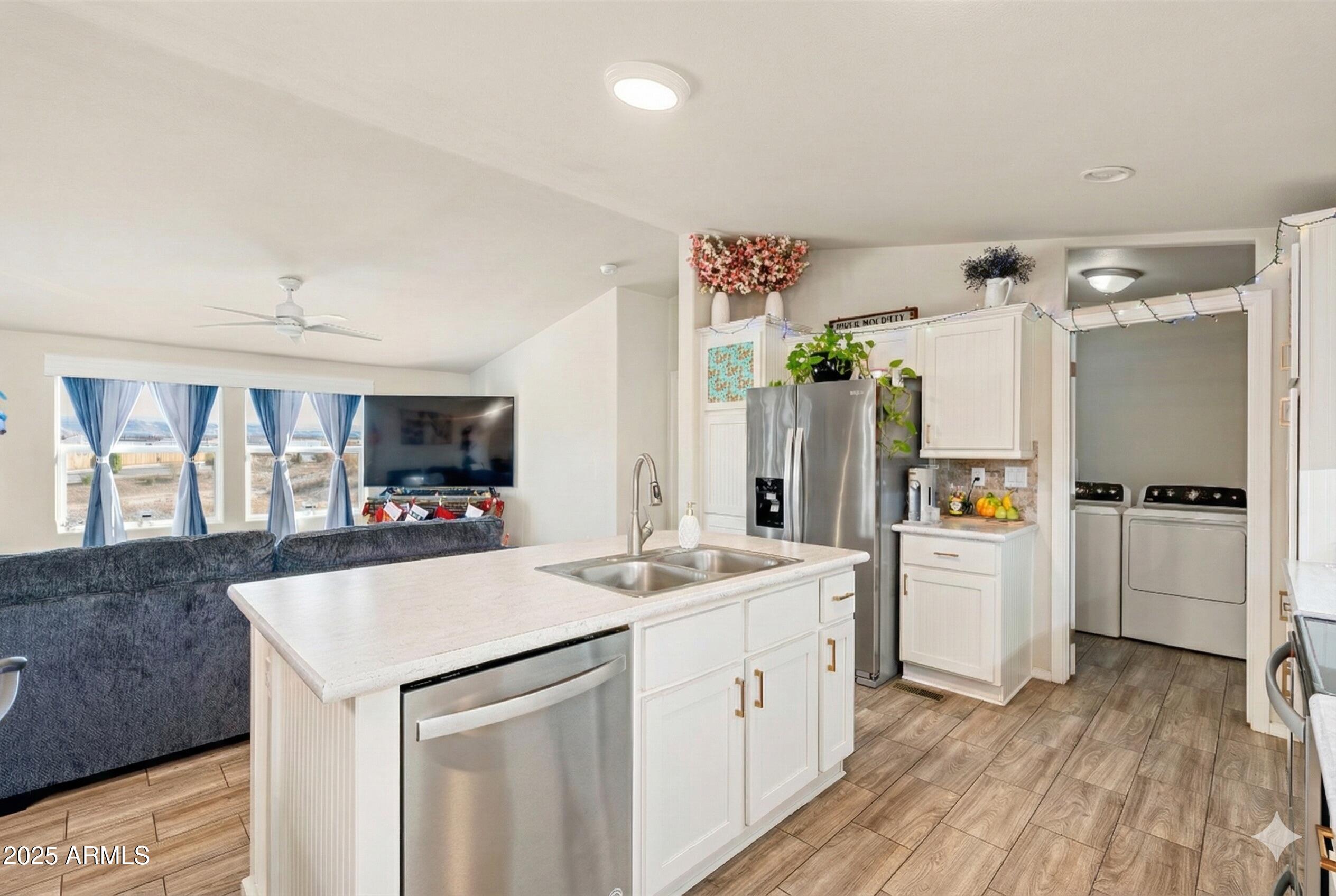 1033 Wheeler Road Camp Verde, AZ 86322 - Photo 11 of 51 a kitchen with a sink a refrigerator and a stove