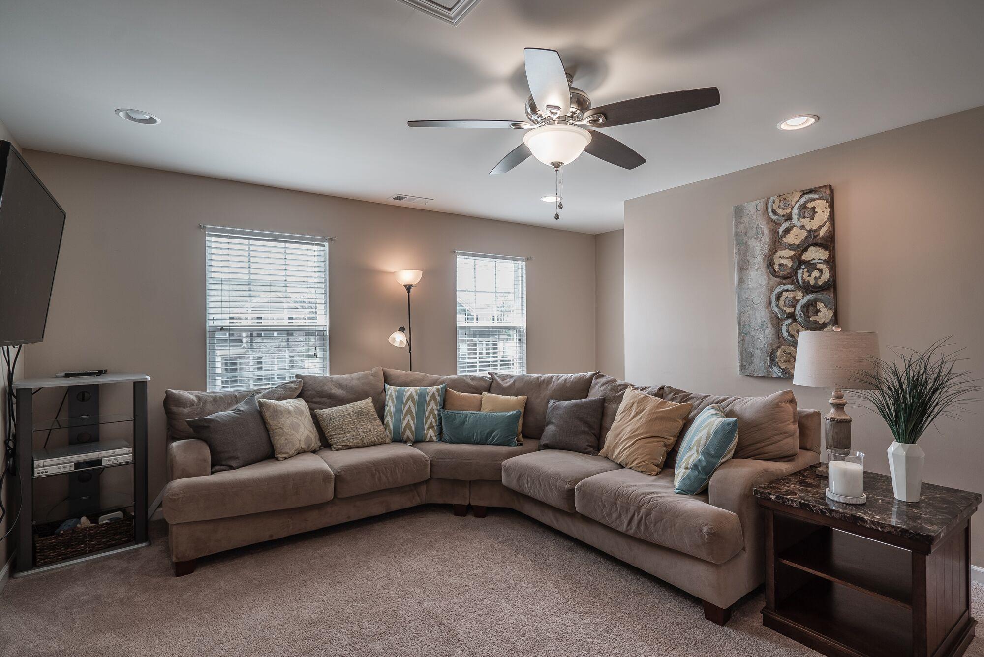 1044 Merrick Road Hendersonville, TN 37075 - Photo 14 of 27 a living room with furniture ceiling fan and a window