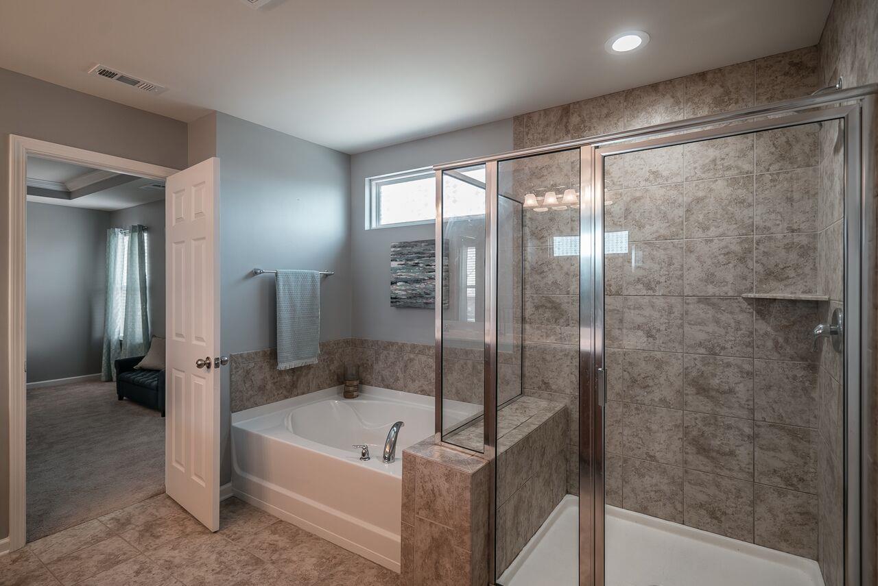 1044 Merrick Road Hendersonville, TN 37075 - Photo 16 of 27 a bathroom with a bathtub and a shower