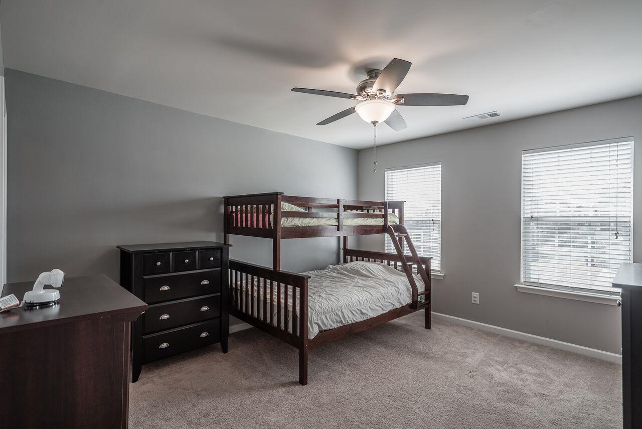 1044 Merrick Road Hendersonville, TN 37075 - Photo 20 of 27 a bedroom with a bed a dresser and a window