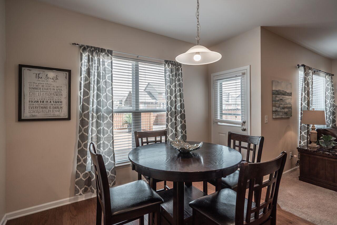 1044 Merrick Road Hendersonville, TN 37075 - Photo 7 of 27 a view of a dining room with furniture window and wooden floor