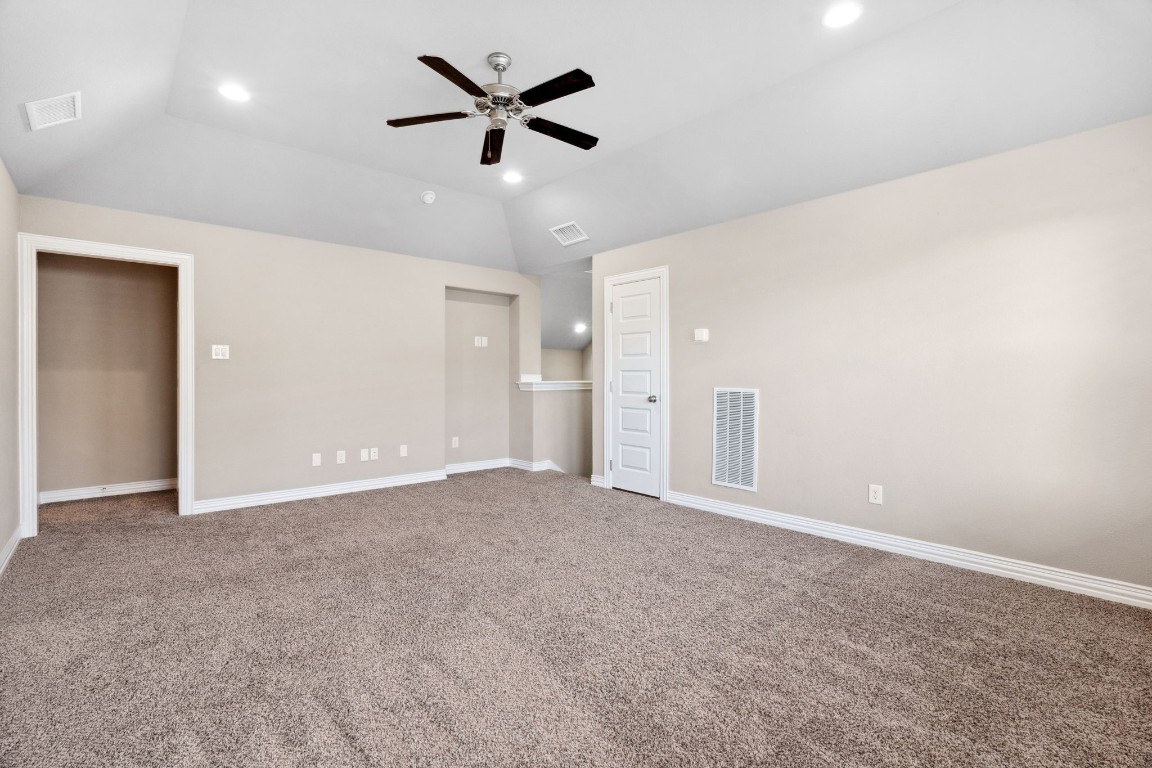 3929 Goodnight Trail Leander, TX 78641 - Photo 22 of 29 an empty room with fan and windows