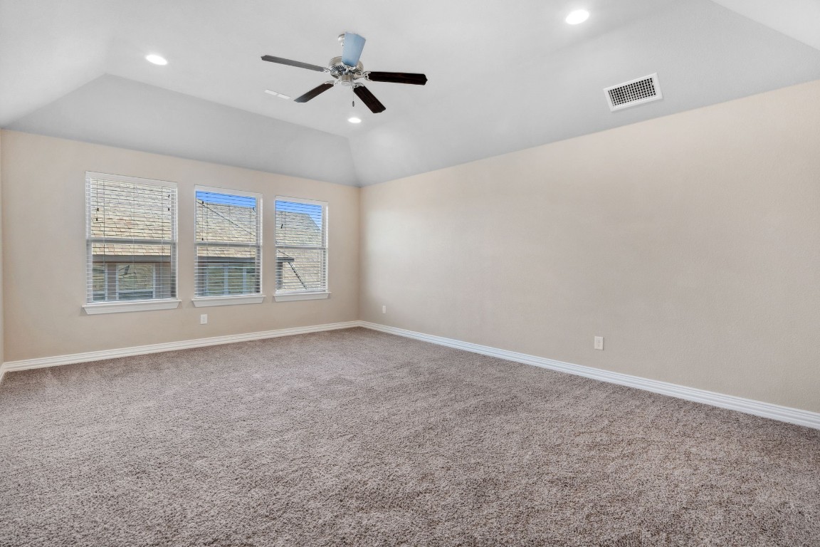3929 Goodnight Trail Leander, TX 78641 - Photo 23 of 29 an empty room with windows and ceiling fan