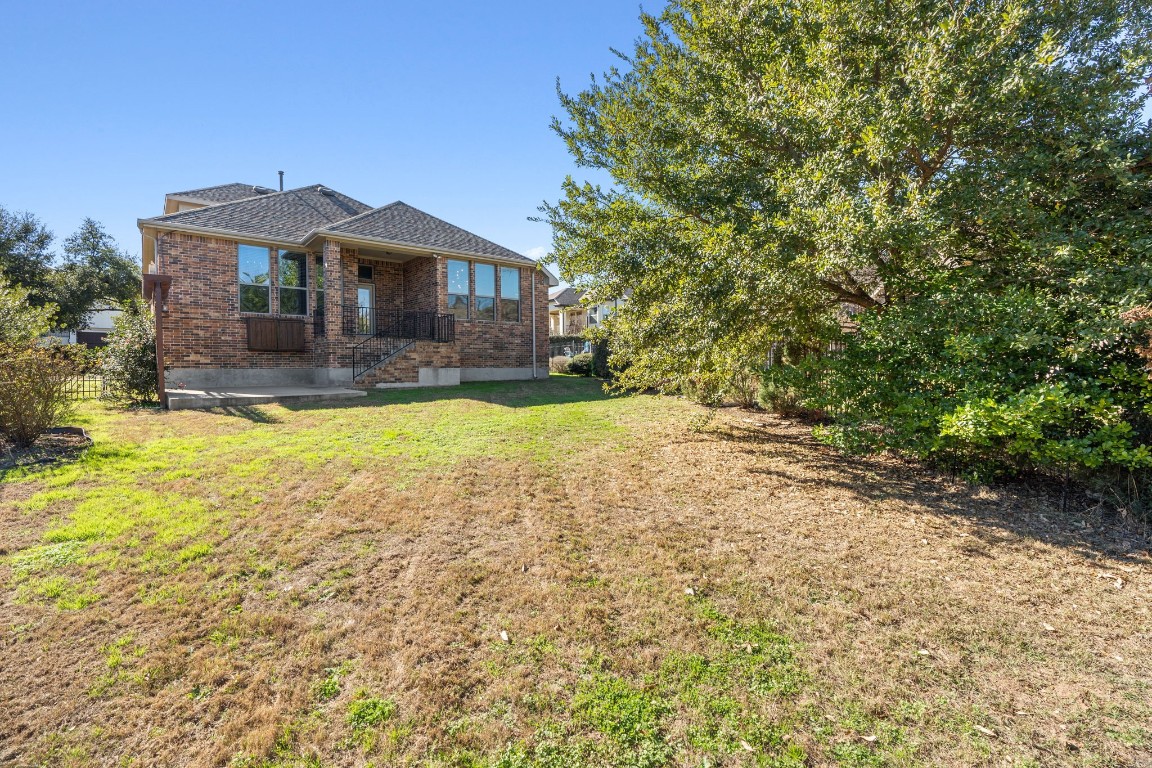 3929 Goodnight Trail Leander, TX 78641 - Photo 25 of 29 a front view of a house with a yard