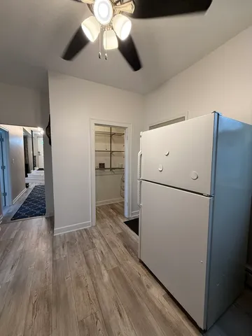 a kitchen with stainless steel appliances wooden cabinets and a stove top oven