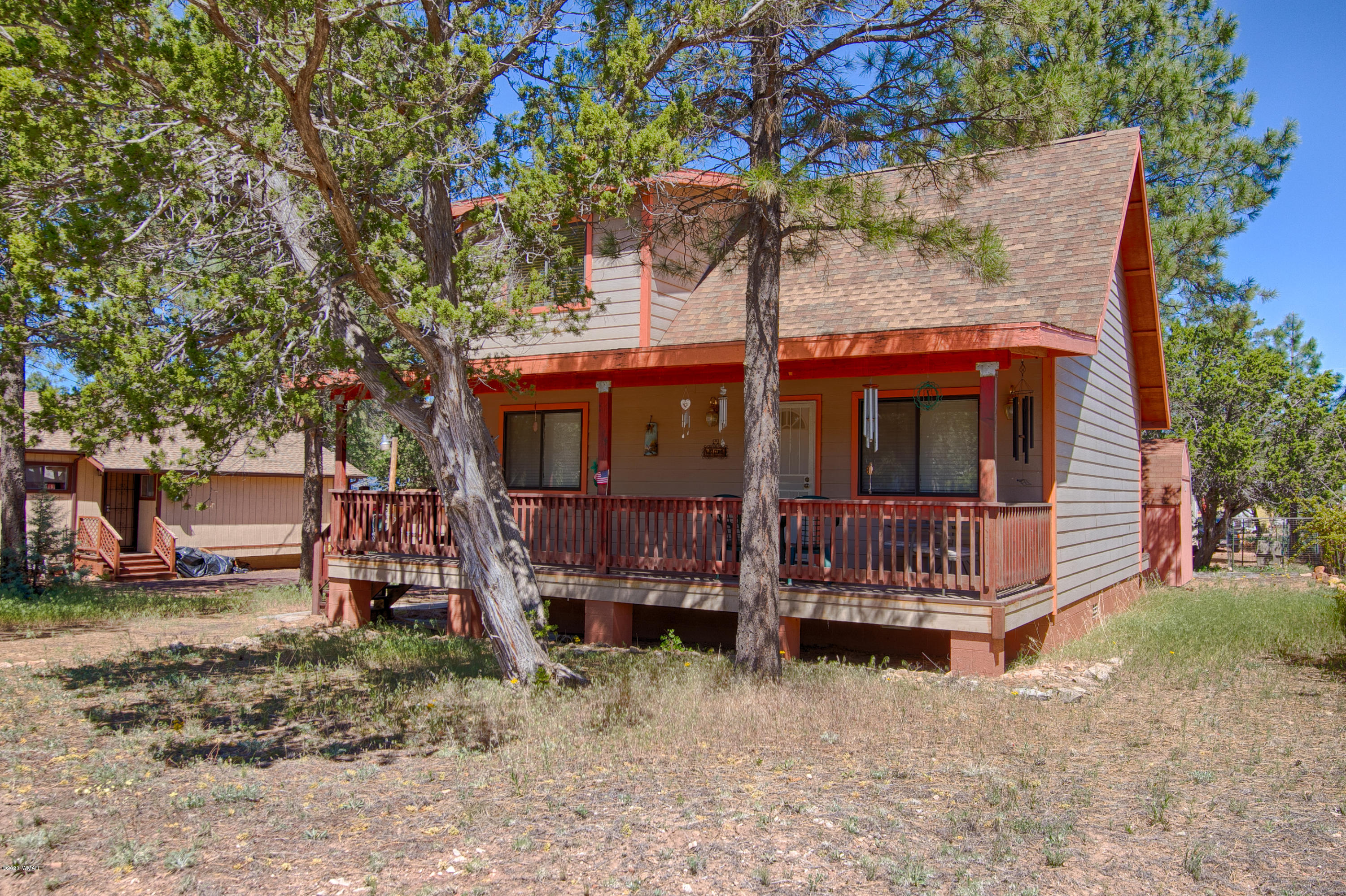 2060 Shot Gun Road Overgaard, AZ 85933 - Photo 1 of 17 front view of a house with a yard