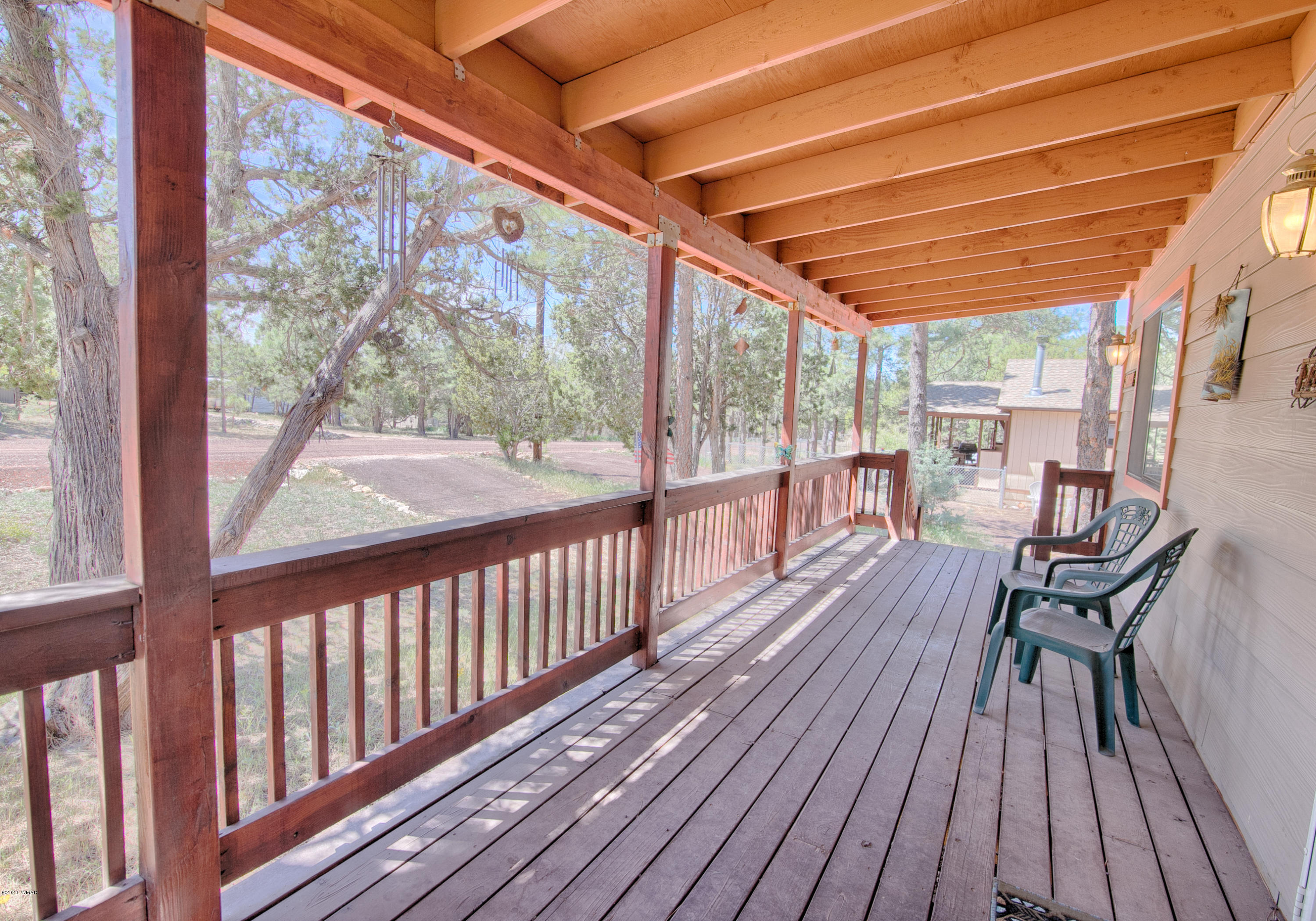 2060 Shot Gun Road Overgaard, AZ 85933 - Photo 3 of 17 a view of a two chairs in the balcony