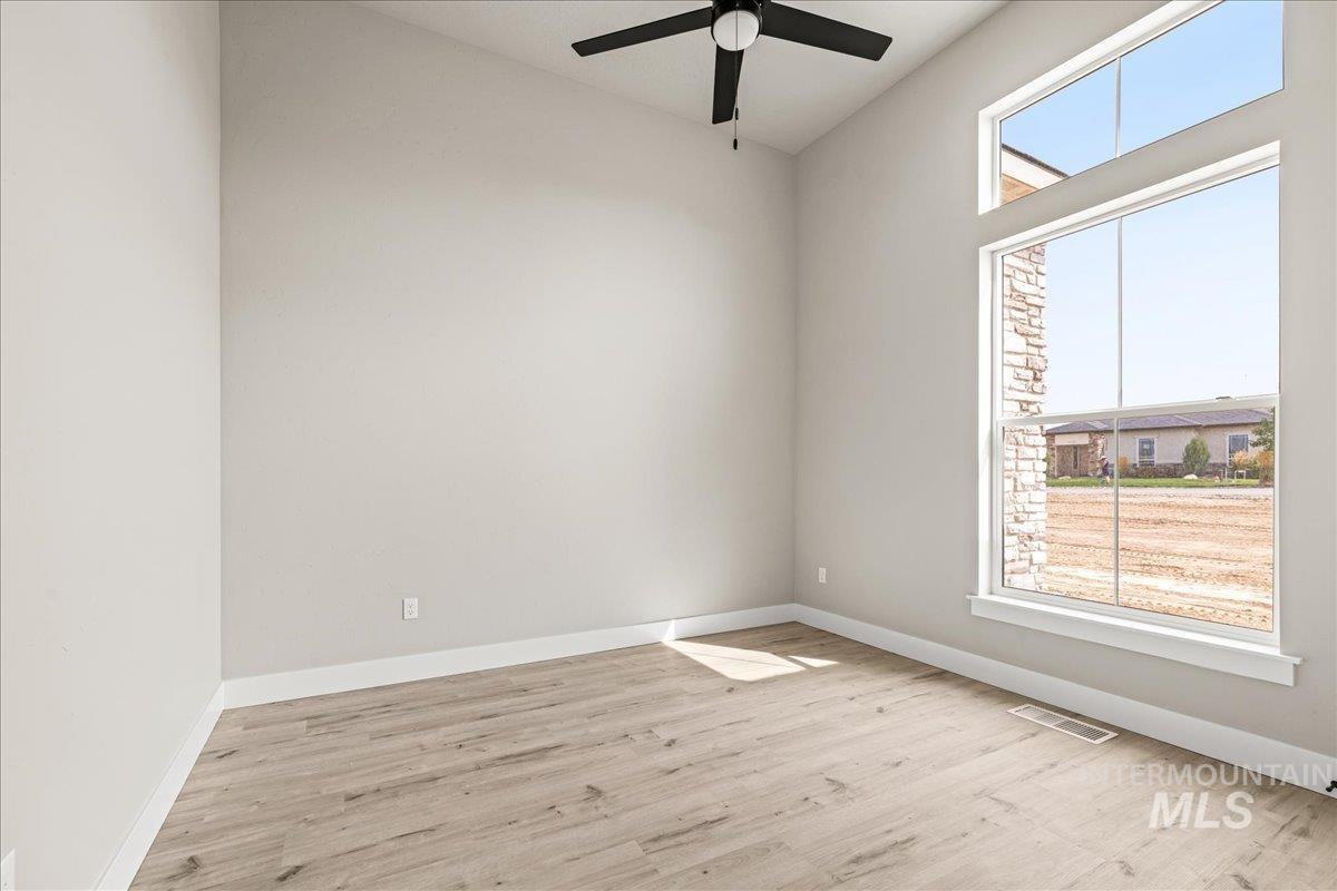 23735 Legends Lane Caldwell, ID 83607 - Photo 27 of 34 Spare room featuring light wood-type flooring and a ceiling fan