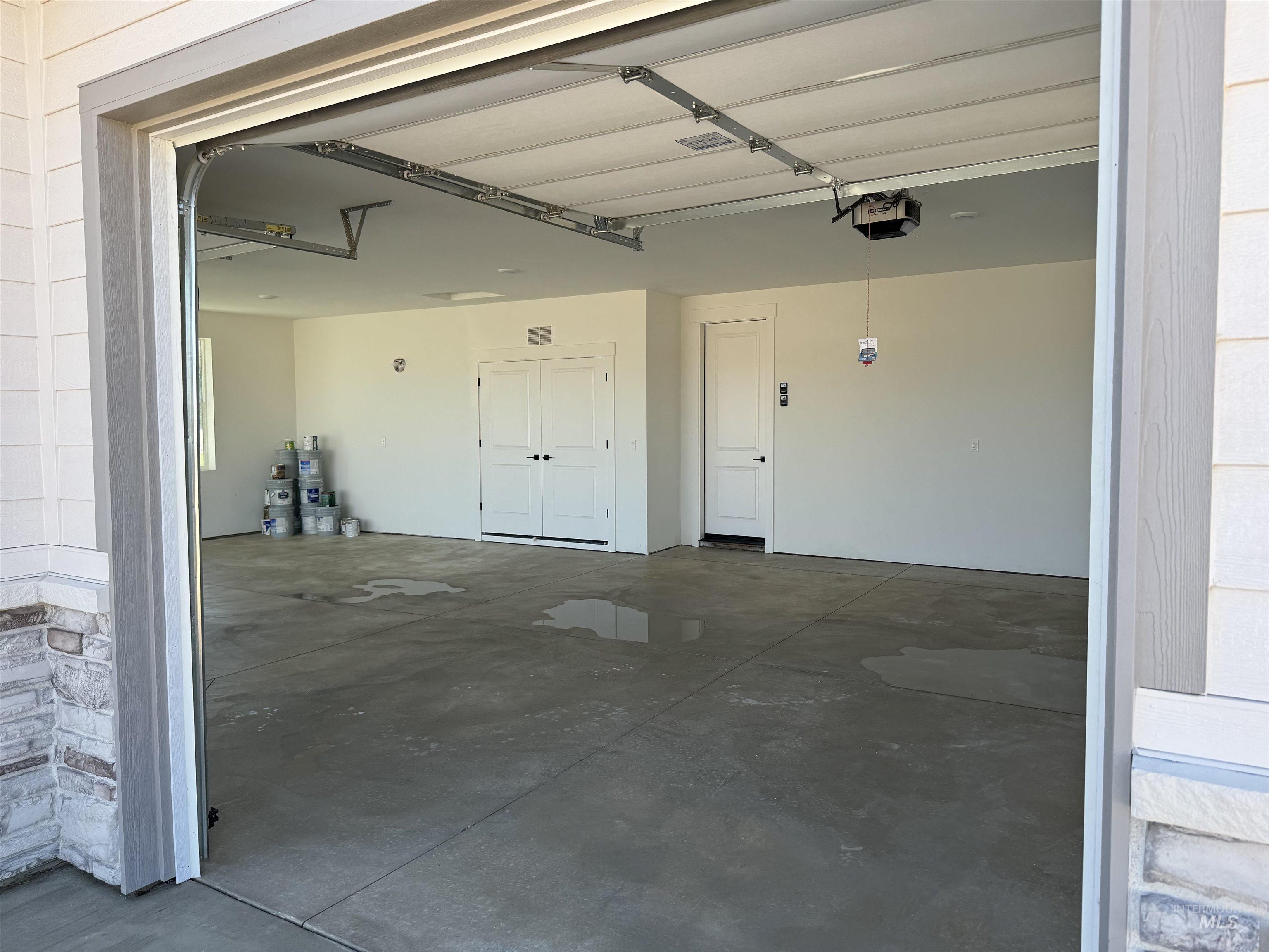 23735 Legends Lane Caldwell, ID 83607 - Photo 4 of 34 Garage with a garage door opener