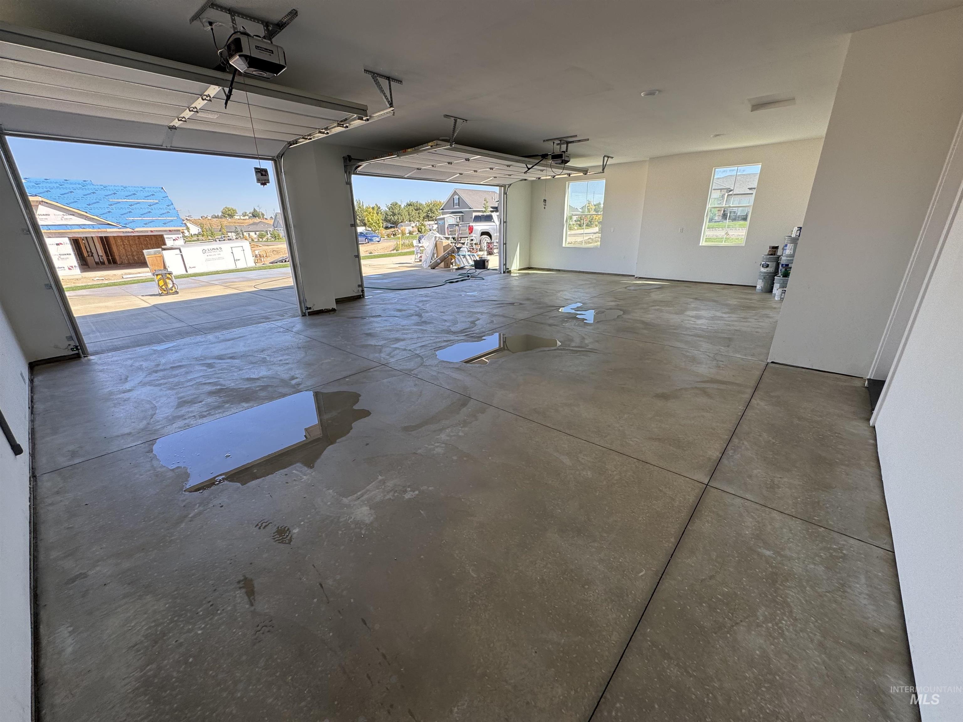 23735 Legends Lane Caldwell, ID 83607 - Photo 6 of 34 Garage with a garage door opener