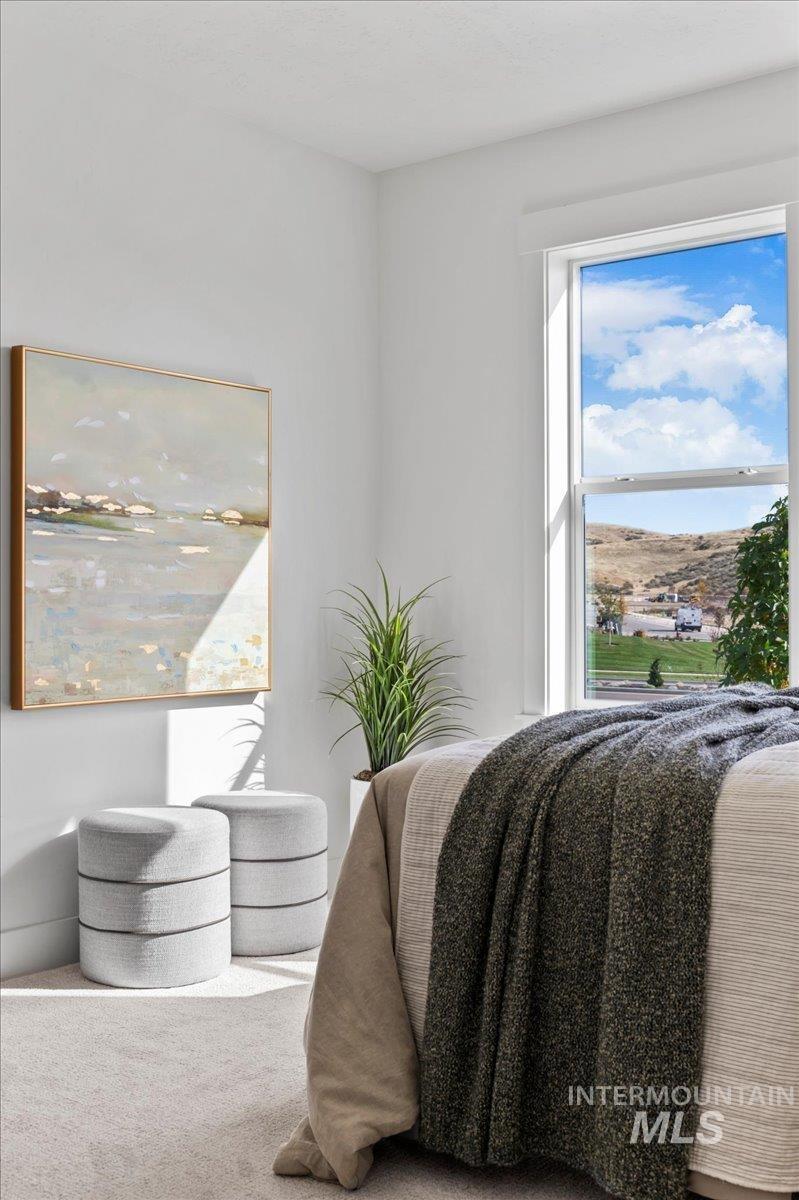 6370 North Barholm Lane Eagle, ID 83616 - Photo 18 of 33 Living area featuring carpet flooring