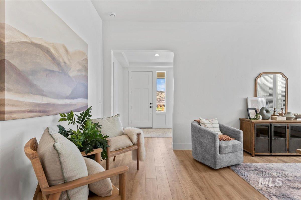 6370 North Barholm Lane Eagle, ID 83616 - Photo 7 of 33 Sitting room with light wood-type flooring and recessed lighting