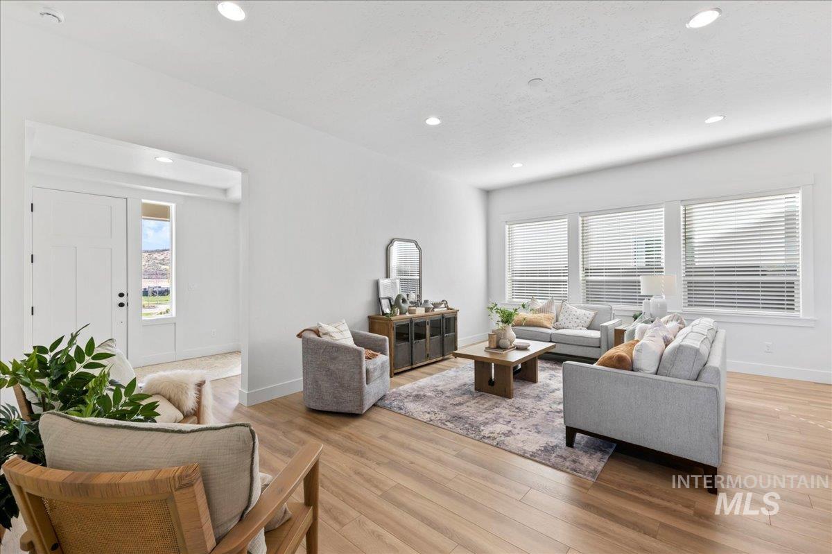 6370 North Barholm Lane Eagle, ID 83616 - Photo 8 of 33 Living room featuring light wood-style floors and recessed lighting