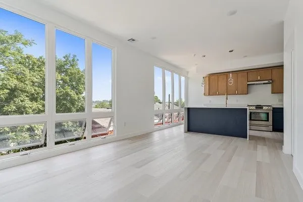 a view of kitchen with furniture and window