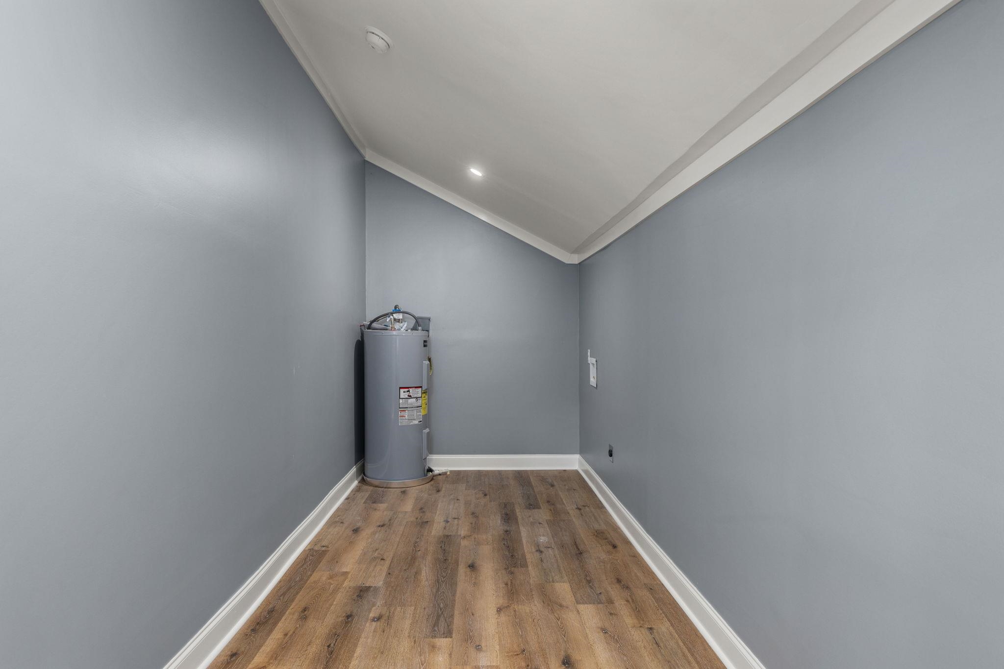 1218 Proper Street Corinth, MS 38834 - Photo 11 of 14 a view of a room with wooden floor and white walls