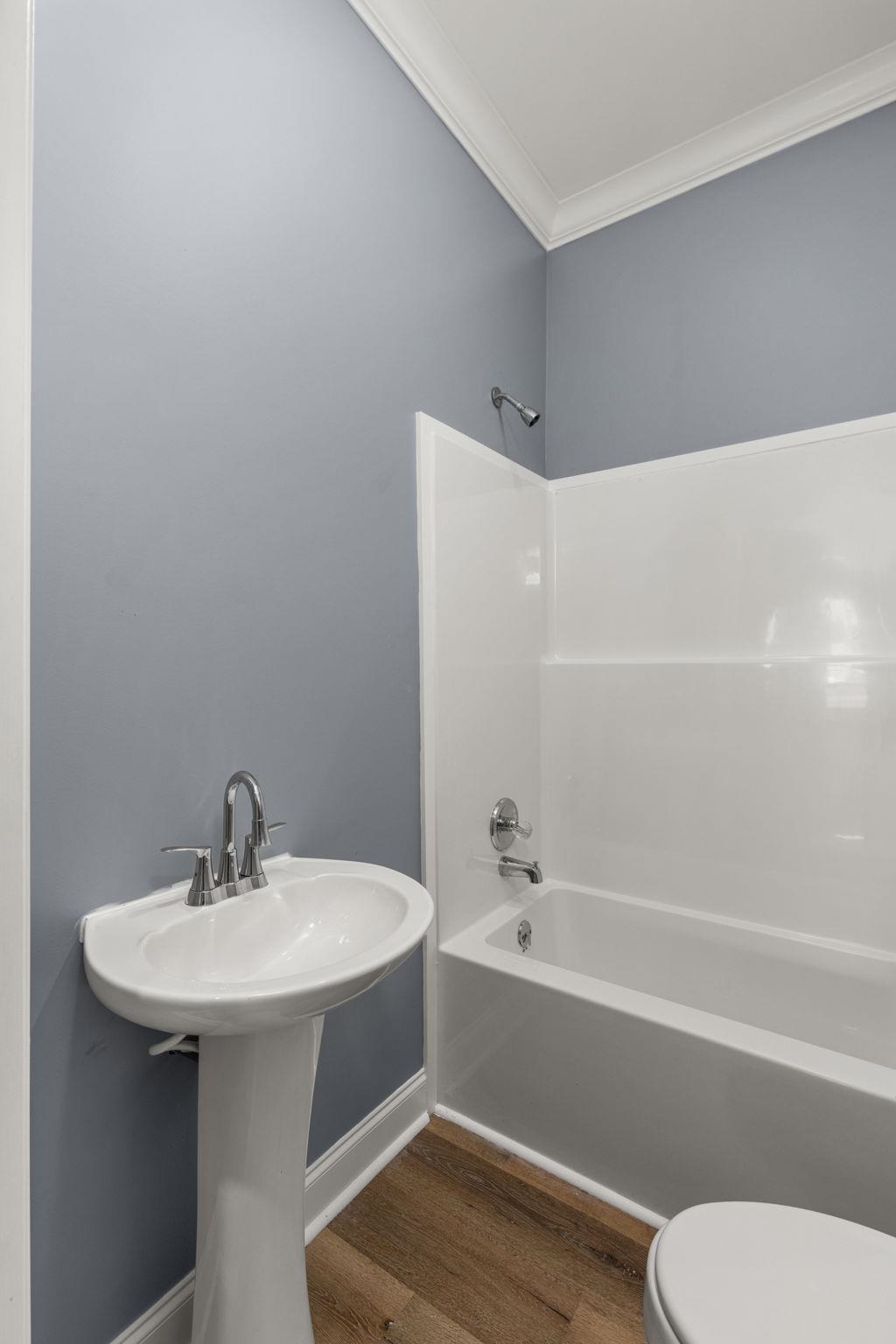 1218 Proper Street Corinth, MS 38834 - Photo 13 of 14 a bathroom with a sink toilet and bathtub