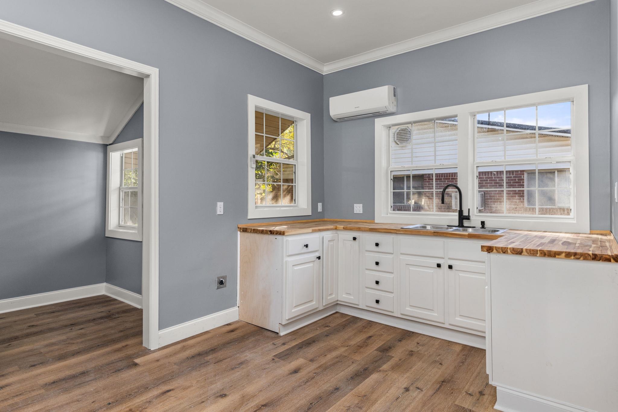 1218 Proper Street Corinth, MS 38834 - Photo 7 of 14 a room with white cabinets and wooden floor