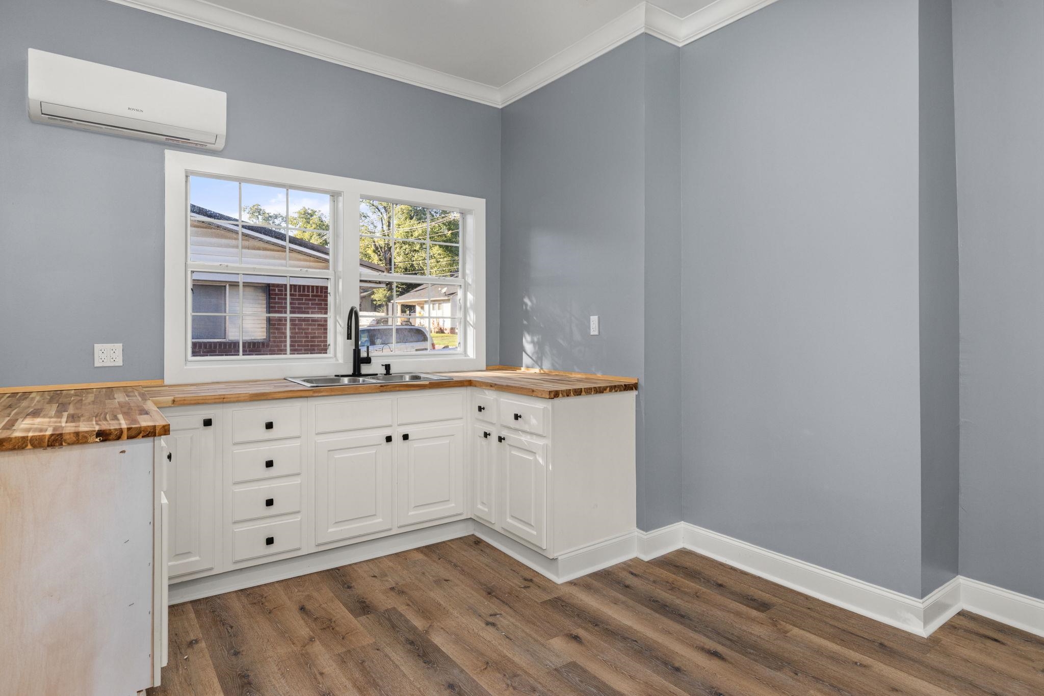 1218 Proper Street Corinth, MS 38834 - Photo 8 of 14 a view of a kitchen with wooden floor