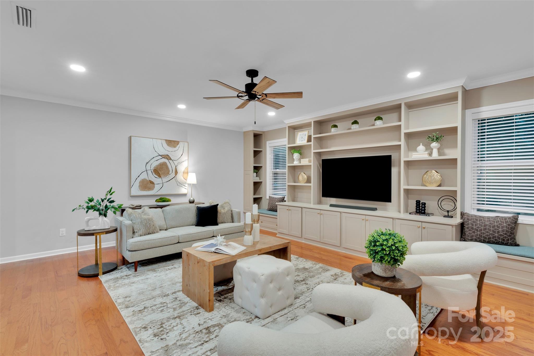 226 Bubbling Well Road Matthews, NC 28105 - Photo 11 of 47 a living room with furniture and a flat screen tv