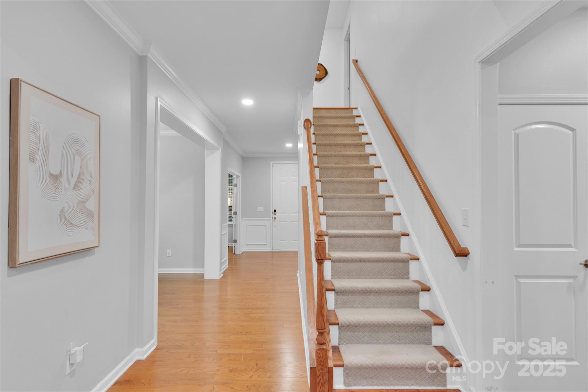 226 Bubbling Well Road Matthews, NC 28105 - Photo 22 of 47 a view of entryway with wooden floor and stairs