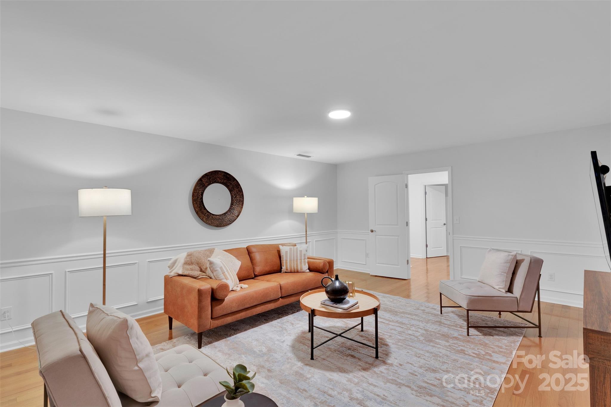 226 Bubbling Well Road Matthews, NC 28105 - Photo 24 of 47 a living room with furniture a rug and a lamp
