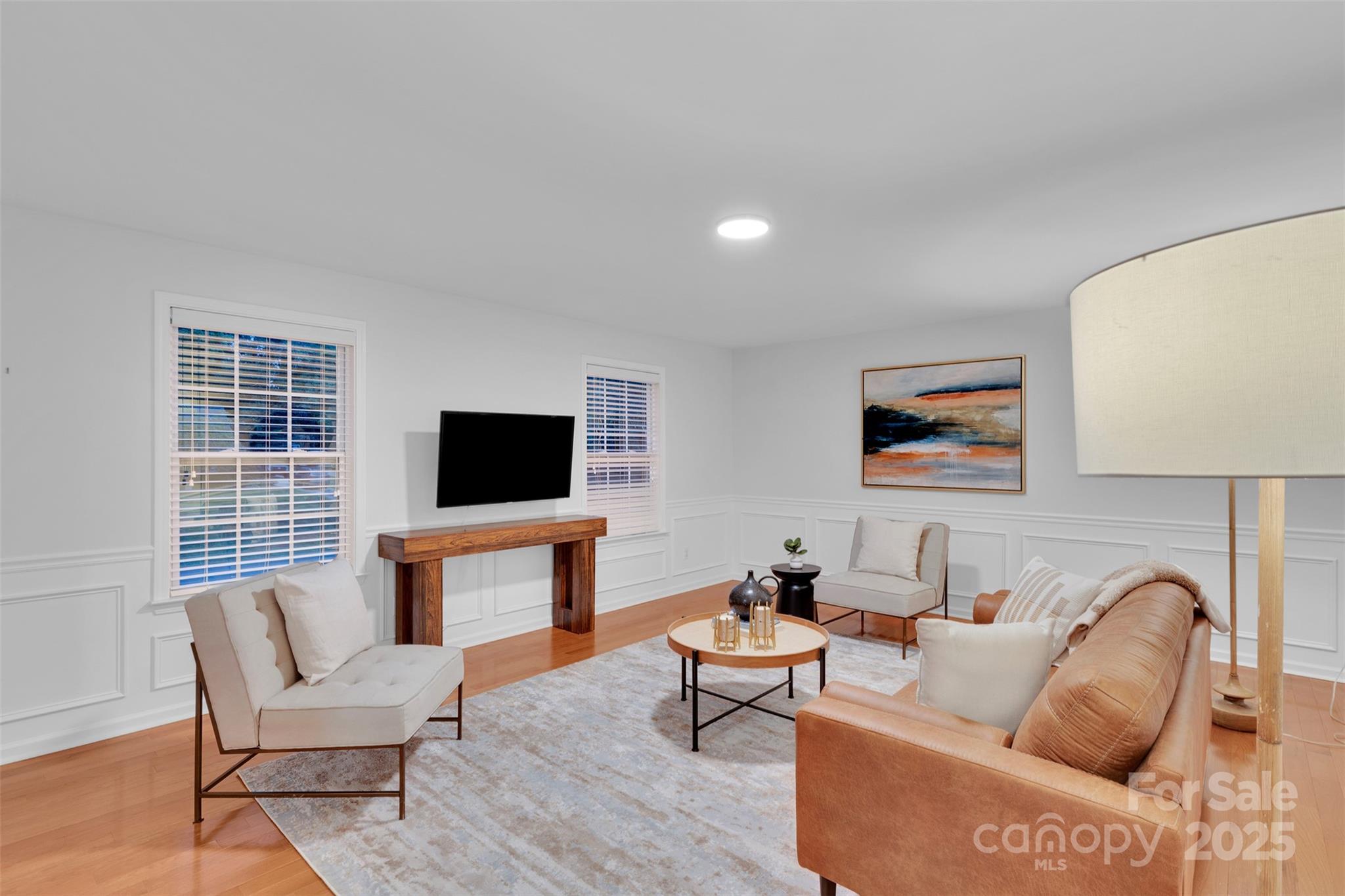 226 Bubbling Well Road Matthews, NC 28105 - Photo 25 of 47 a living room with furniture and a flat screen tv