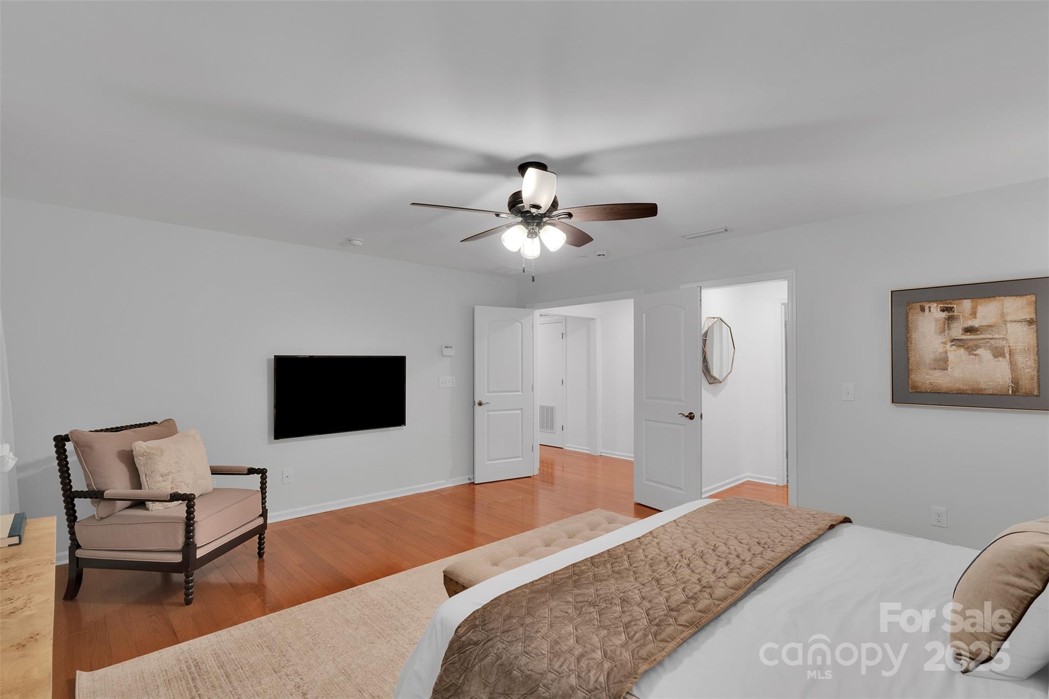 226 Bubbling Well Road Matthews, NC 28105 - Photo 28 of 47 a bedroom with a bed and a flat screen tv