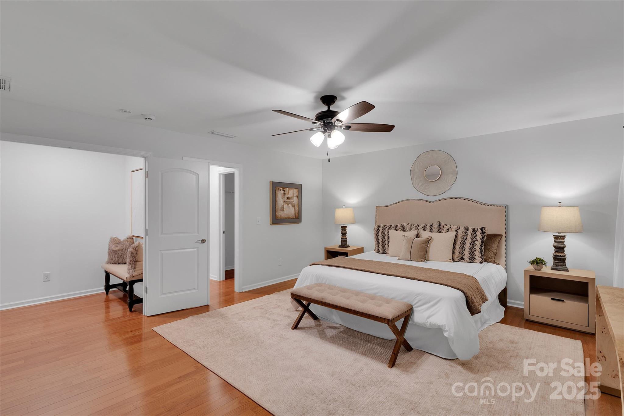 226 Bubbling Well Road Matthews, NC 28105 - Photo 30 of 47 a bedroom with a bed and a chandelier