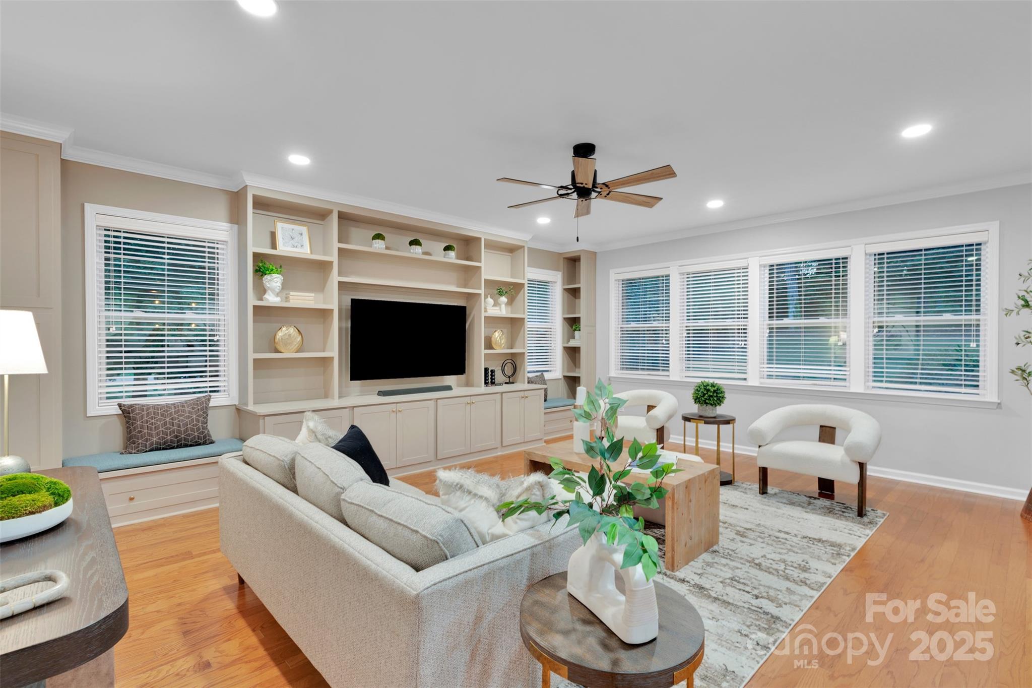 226 Bubbling Well Road Matthews, NC 28105 - Photo 3 of 47 a living room with furniture and a flat screen tv