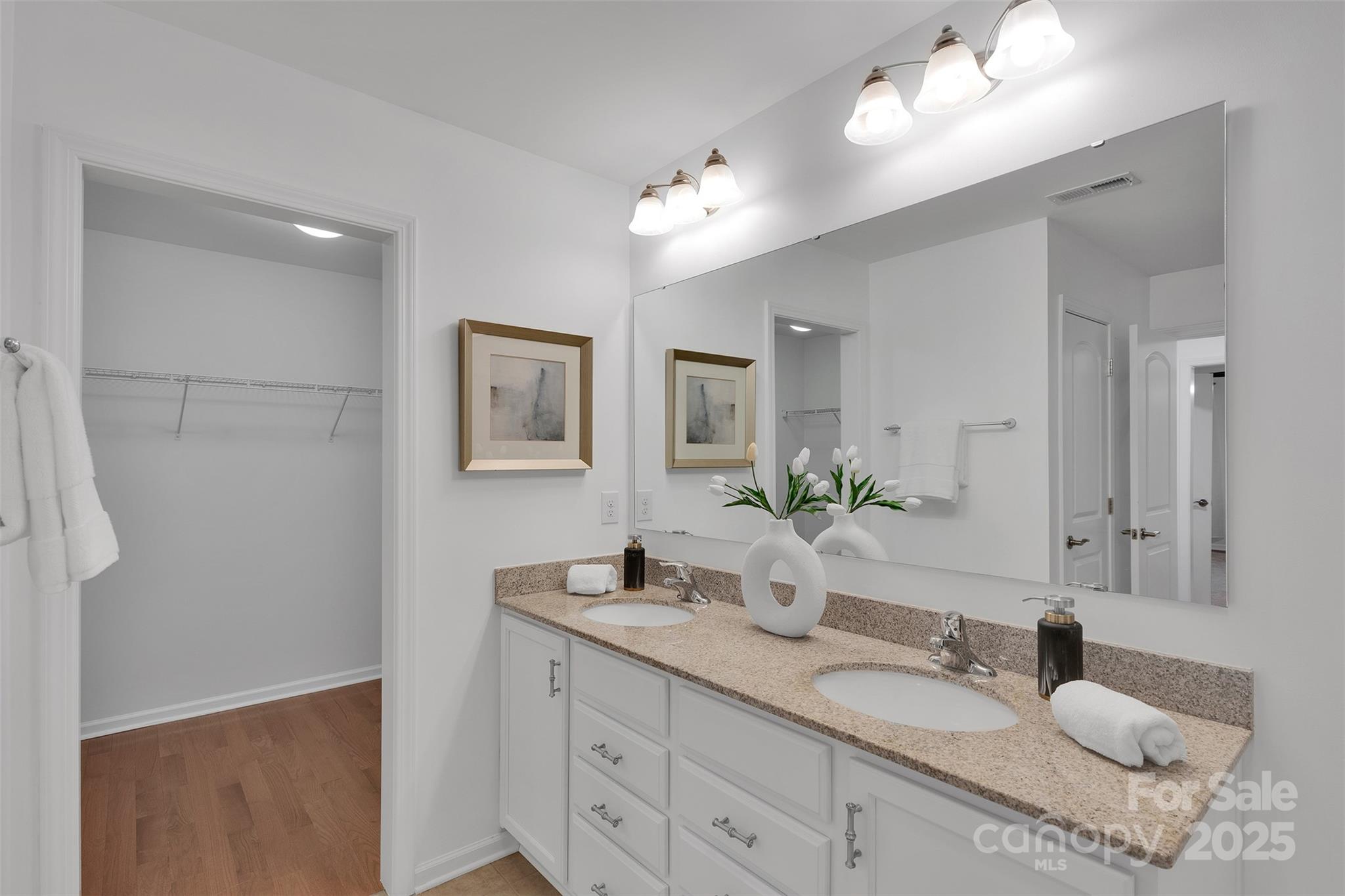 226 Bubbling Well Road Matthews, NC 28105 - Photo 33 of 47 a bathroom with a granite countertop sink and a mirror