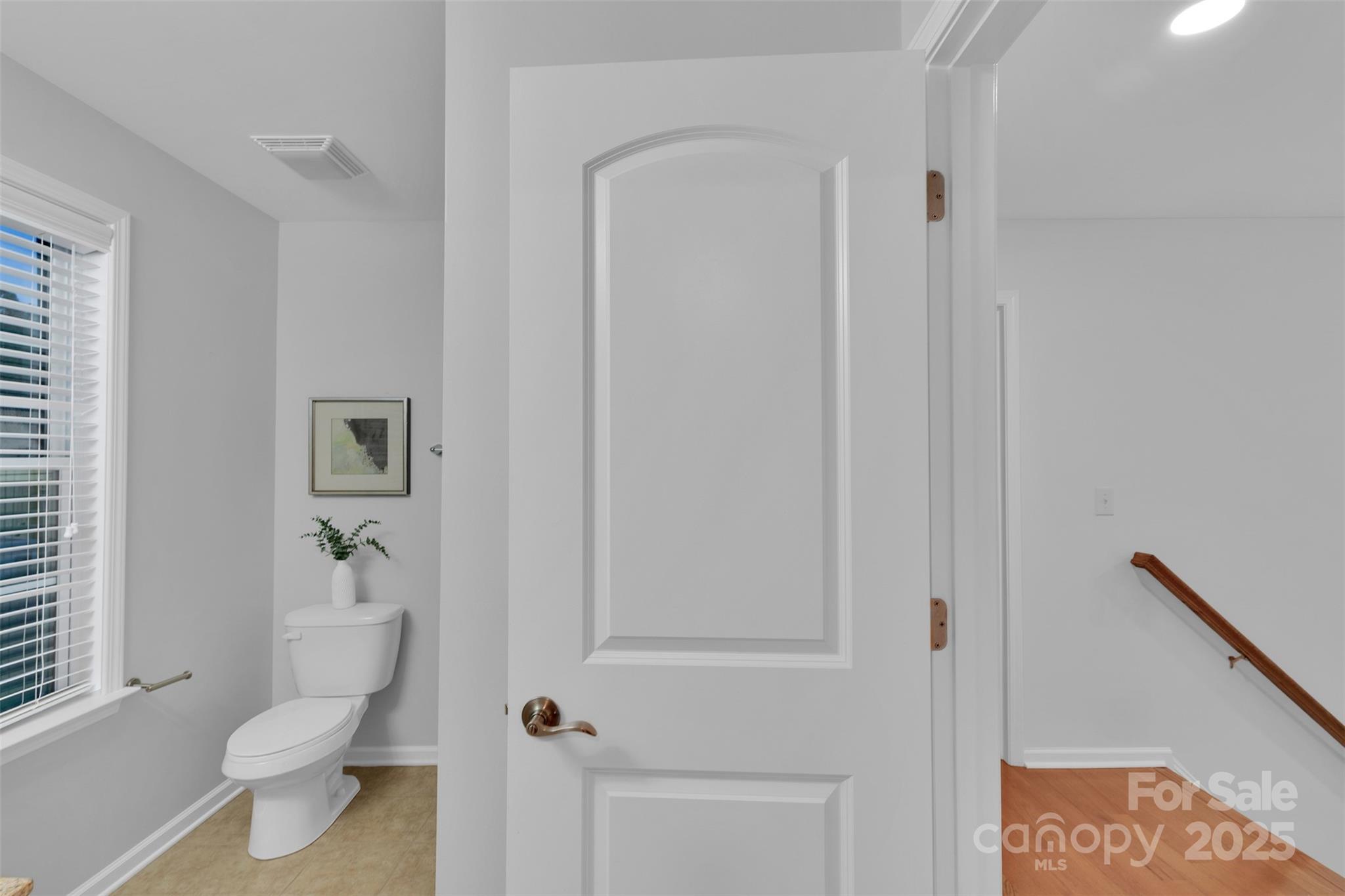 226 Bubbling Well Road Matthews, NC 28105 - Photo 37 of 47 a white toilet sitting next to a bathroom sink